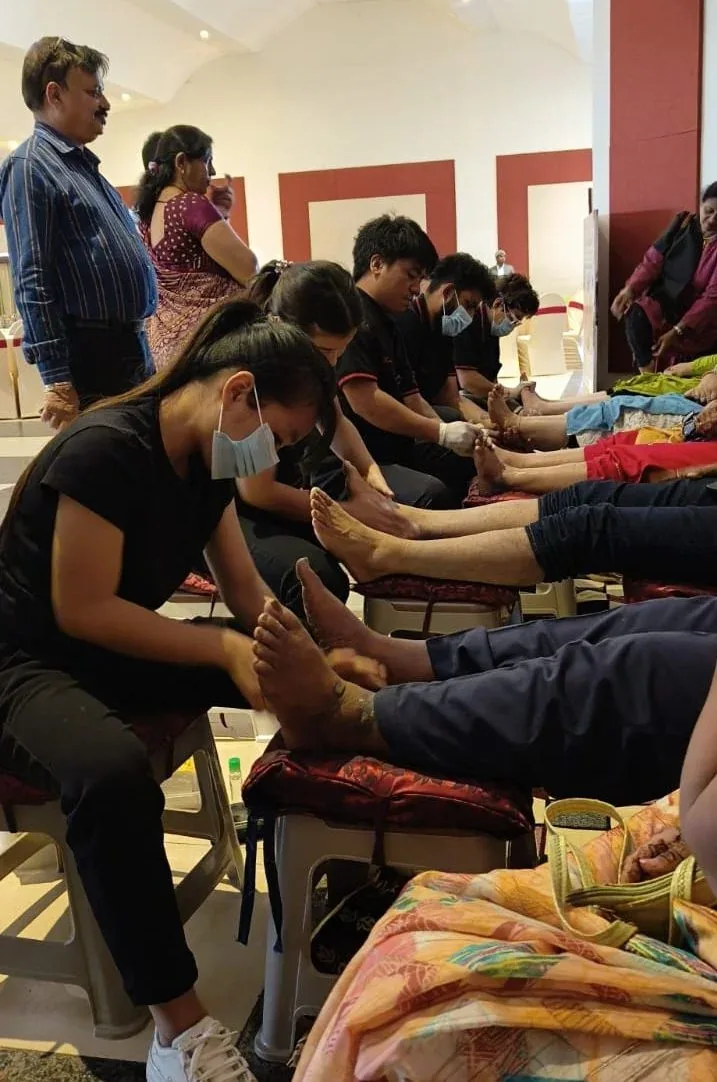 Foot massage at a corporate event